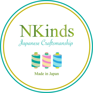 Logo of NKinds with colorful spools and 'Made in Japan' text on a white background